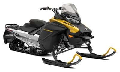 A black and yellow Ski-Doo snowmobile with a clear windshield, sturdy skis in front, and a track system at the rear, designed for riding on snow.